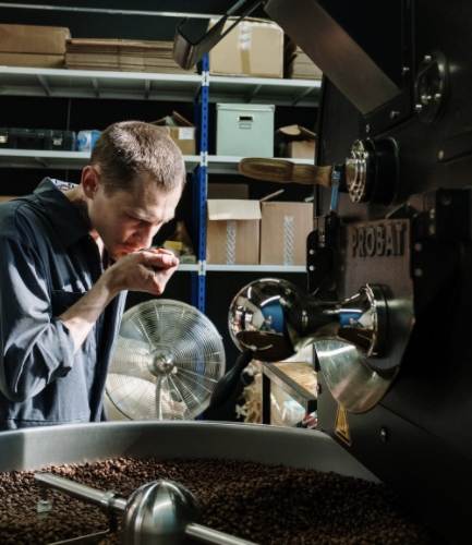 A man smelling coffee